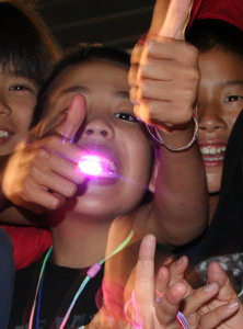 boy with lights in his mouth